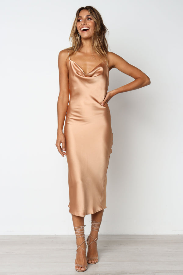 DRESSES Persia Dress - Gold DRESSES Persia Dress - Gold. Stunning cowl neck, midi dress with adjustable straps in a sexy satin fabrication. Offering a flattering feminine silhouette that can be dressed up or dressed down. Perfect for weddings, date nights, Spring parties, brunch, day events, and more. 